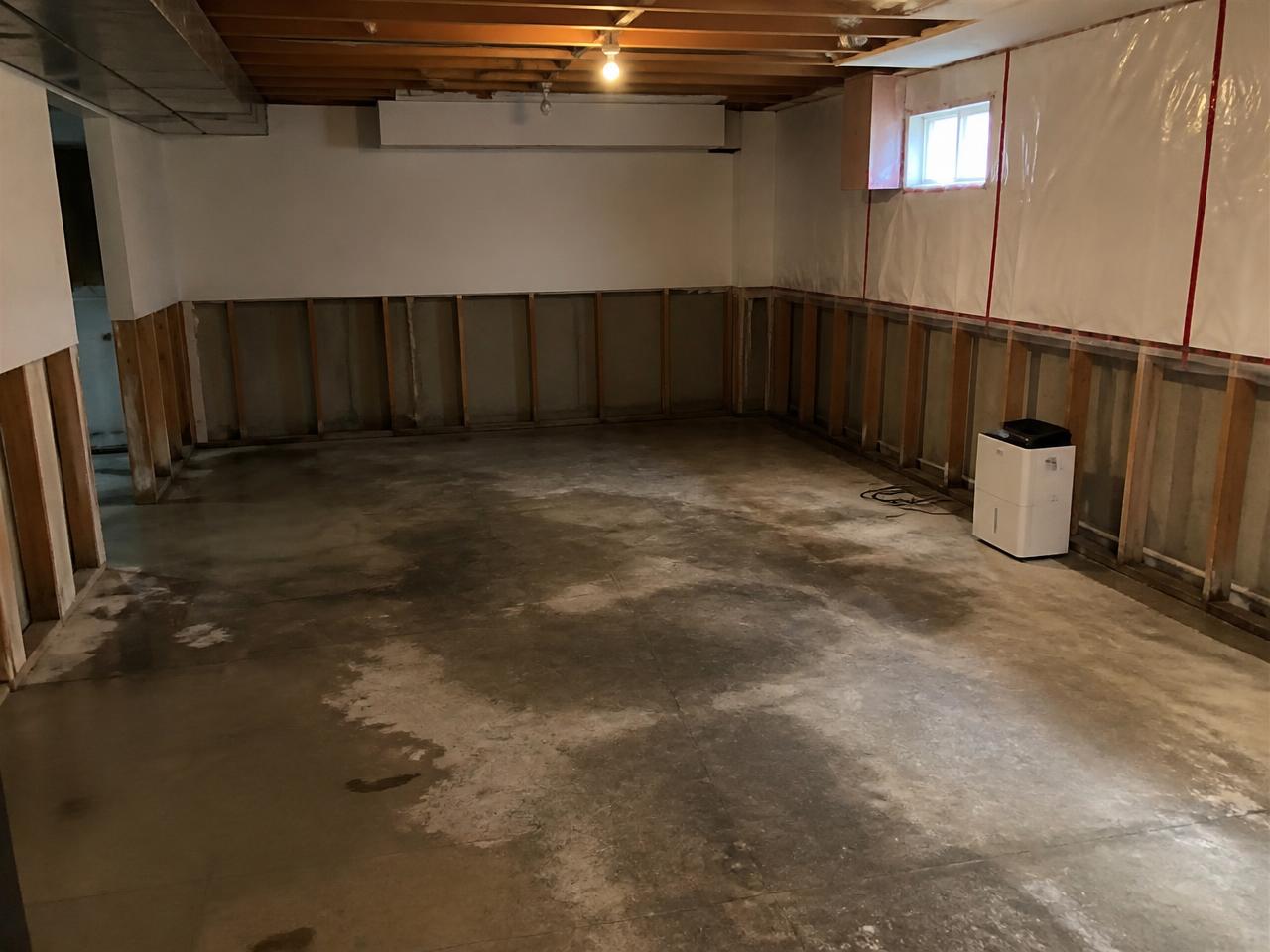 Basement contaminated by a sewage backup before professional cleanup