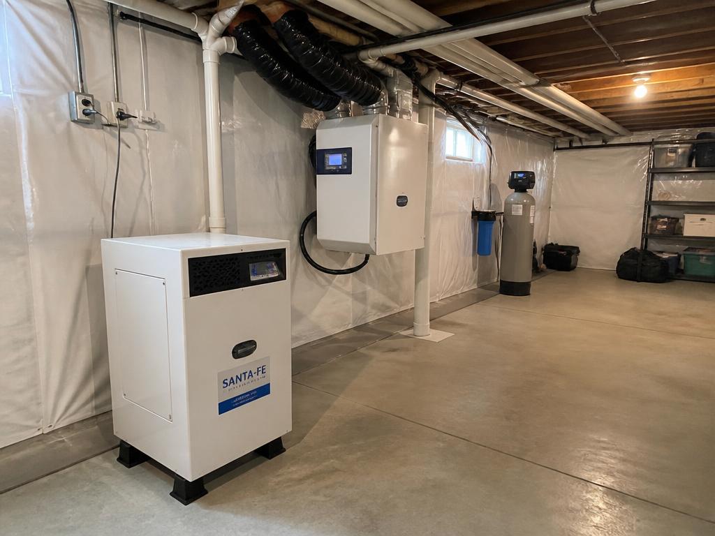 Dehumidifier and moisture control equipment installed in a clean basement